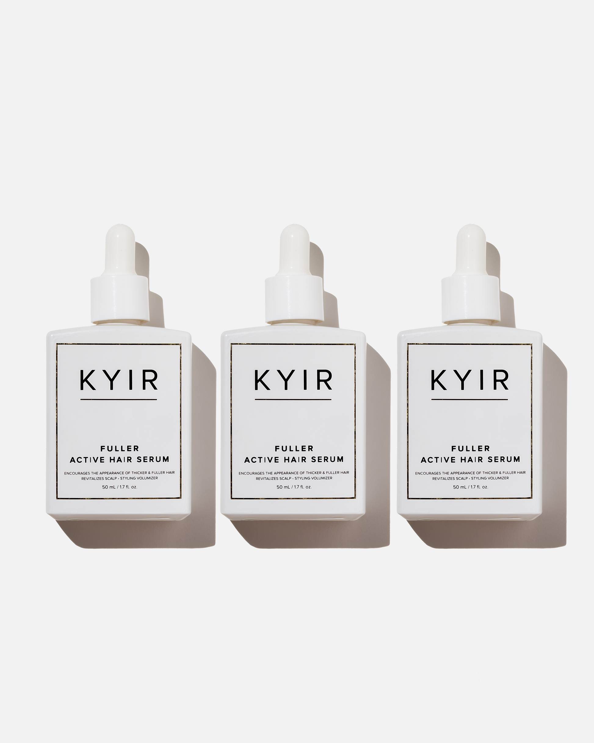 Three bottles of LoveKyir Fuller Active Hair Serum with white labels and droppers