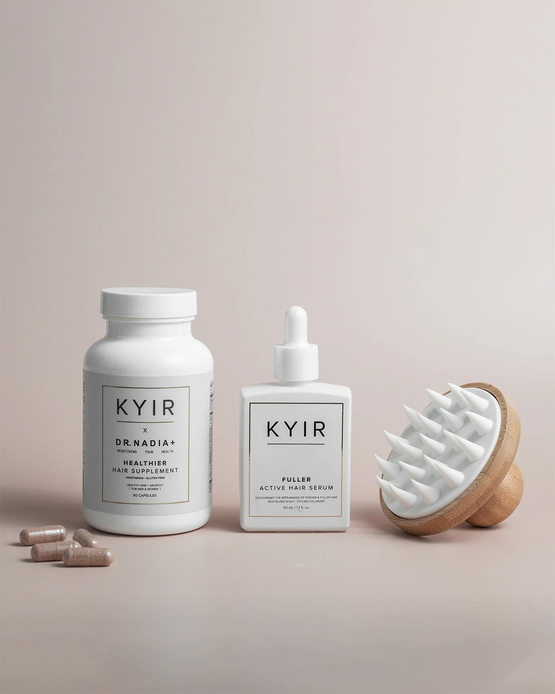 Kyir Method hair supplement bottle, active hair serum, and scalp massager with capsules